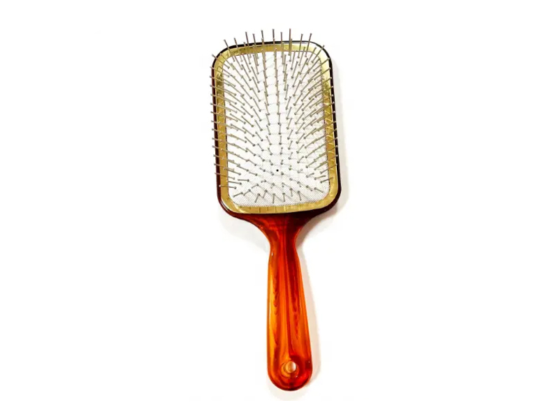 Escova de cabelo de cor âmbar com pinos de metal