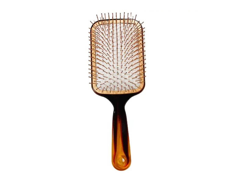 Escova de cabelo de cor âmbar com pinos de metal